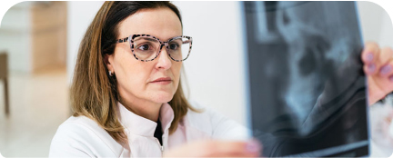 Woman examining an X-ray