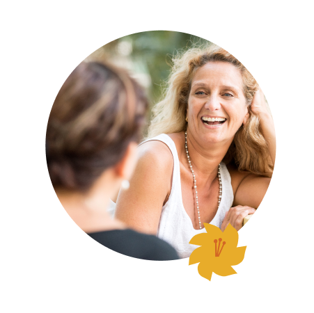 A woman smiling at her friend