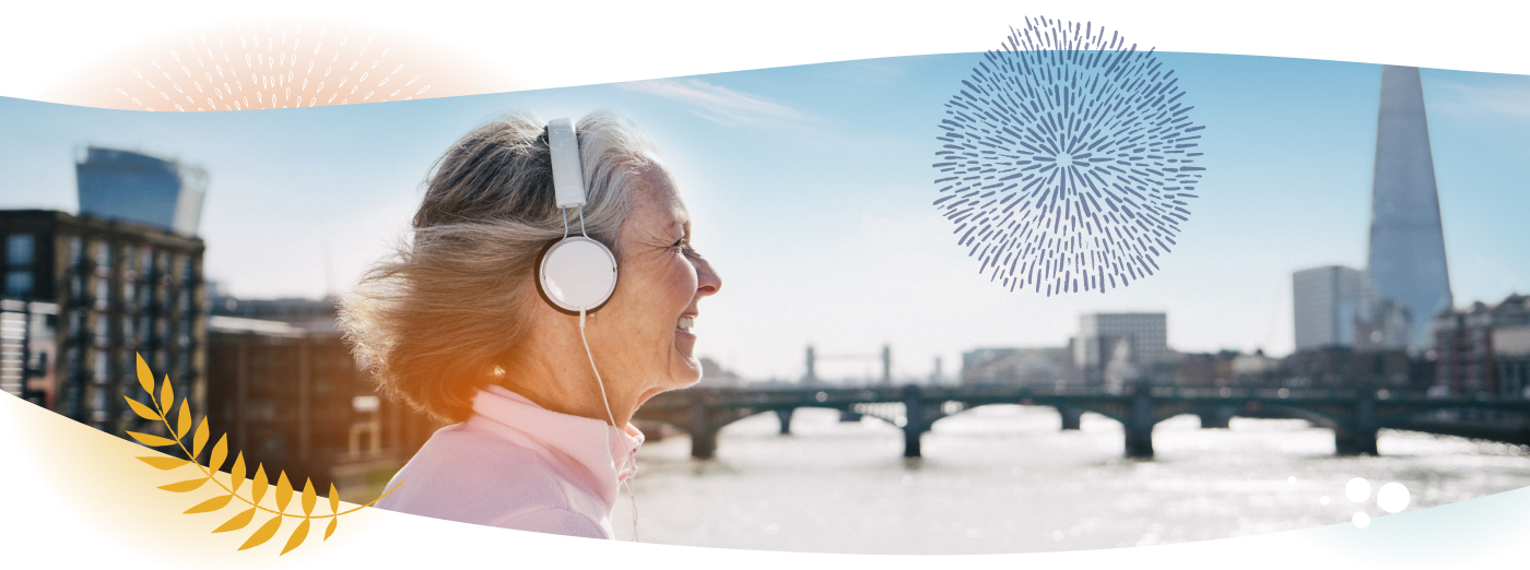 A woman with headphones walking